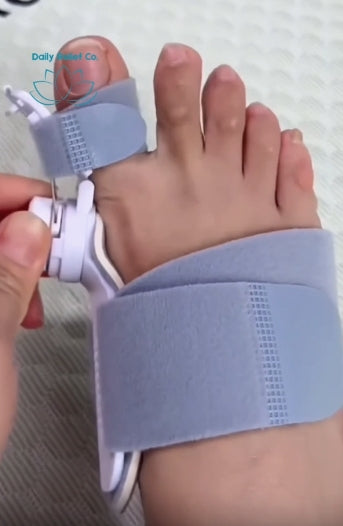 Toe separator device being used on a foot with a white background